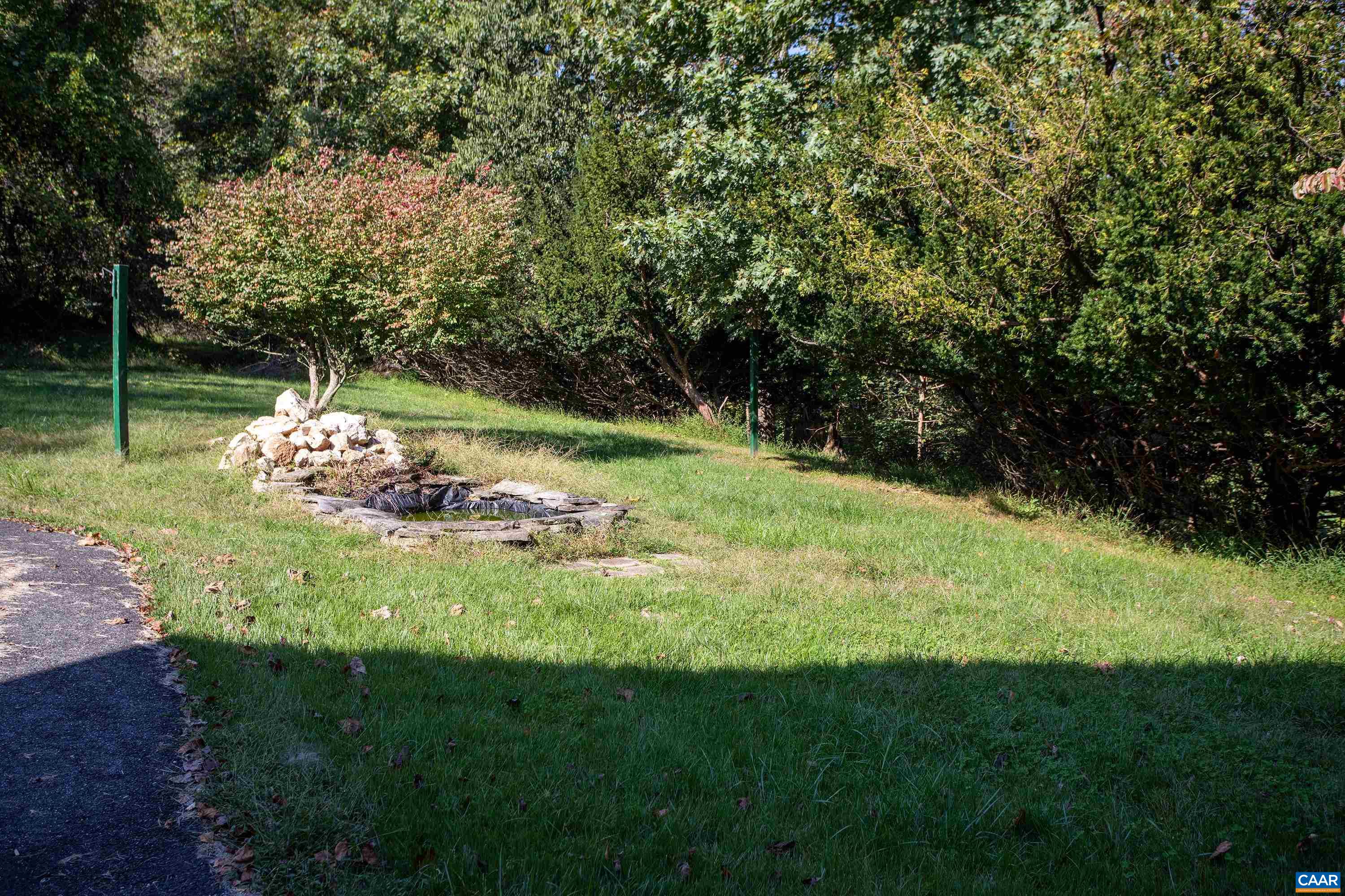 2617 Northfield Road Charlottesville, VA 22901 - Photo 8 of 68 a garden with trees in the background
