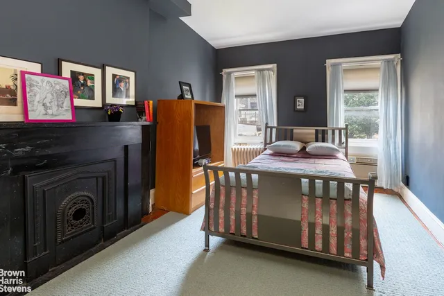 a bedroom with furniture and a window