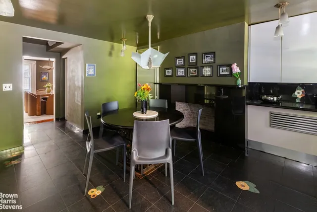 a dining room with furniture and wooden floor