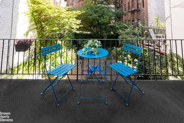 a view of a chairs and tables in the back yard