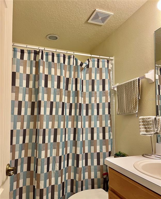 232 Cape Harbour Loop, Unit 101 Bradenton, FL 34212 - Photo 13 of 16 a bathroom with a sink toilet and shower