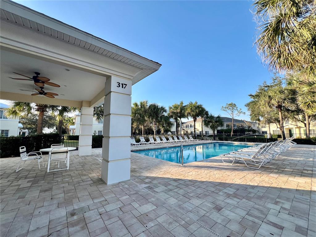 232 Cape Harbour Loop, Unit 101 Bradenton, FL 34212 - Photo 15 of 16 a view of a house with backyard and sitting area