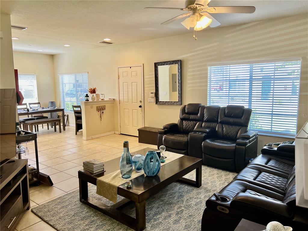232 Cape Harbour Loop, Unit 101 Bradenton, FL 34212 - Photo 6 of 16 a living room with furniture and wooden floor