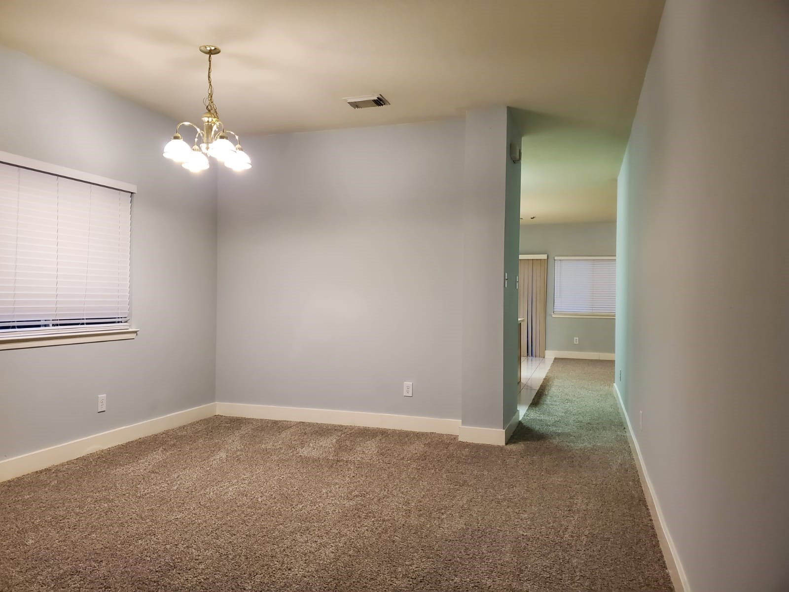 5722 Sonoma Ridge Missouri City, TX 77459 - Photo 11 of 12 a view of a chandelier in big room with a chandelier fan