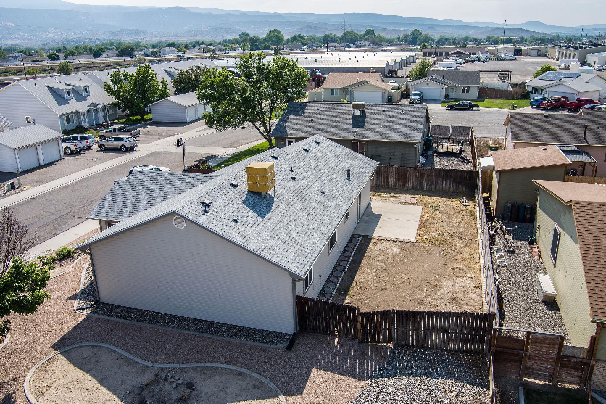 455 David Court Fruita, CO 81521 - Photo 23 of 28 an aerial view of a house with a garden and mountain view