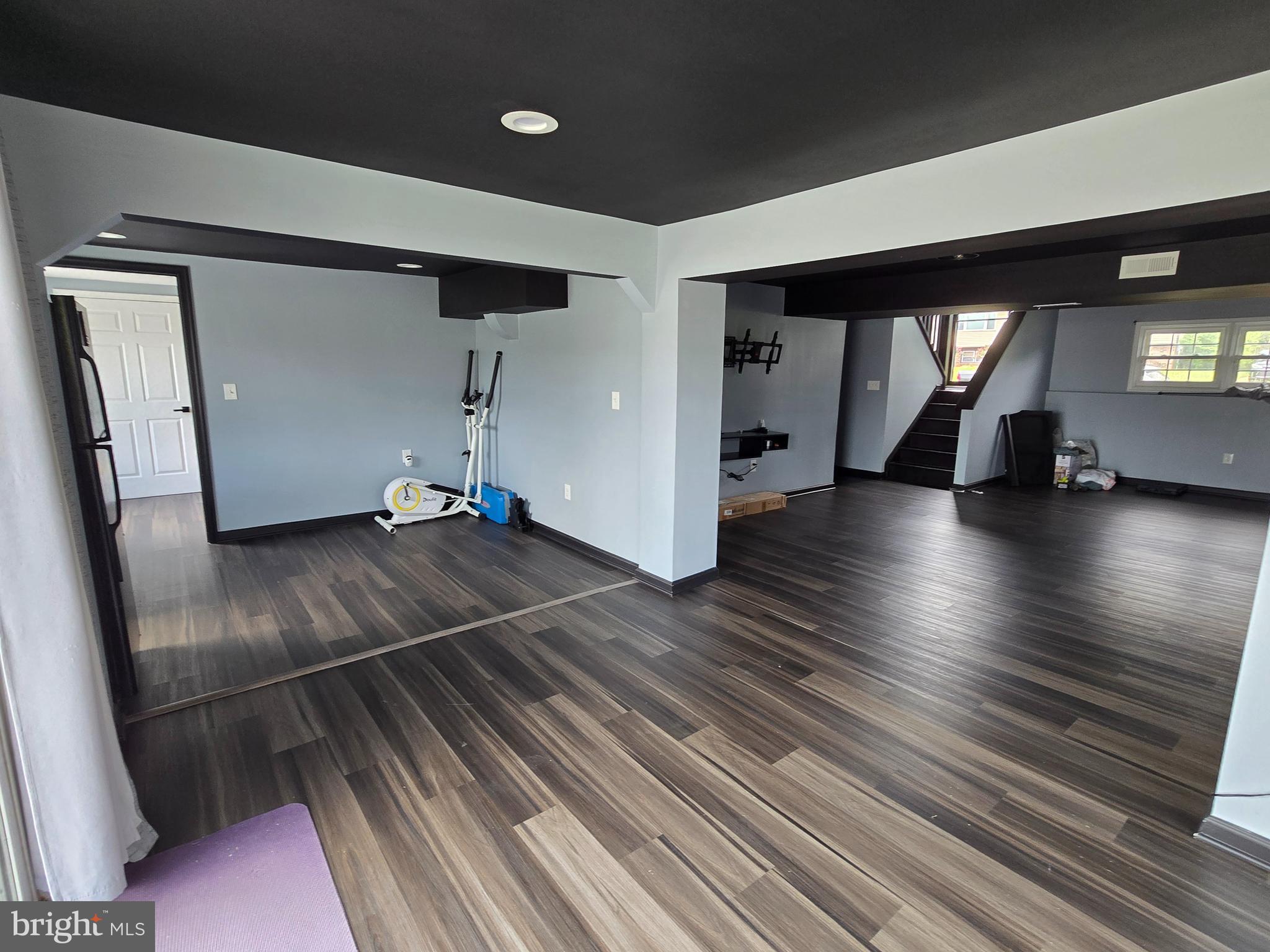 7513 Saffron Court Hanover, MD 21076 - Photo 30 of 42 a view of an empty room with wooden floor and a window