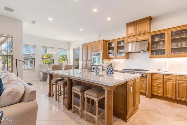 a view of a dining room with furniture and a large window
