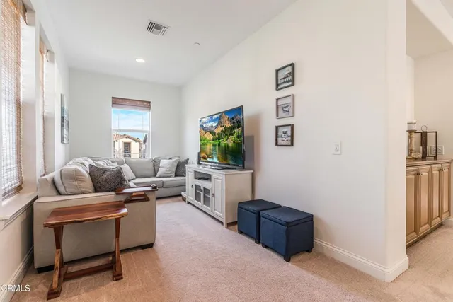 a spacious bedroom with a bed and a couch