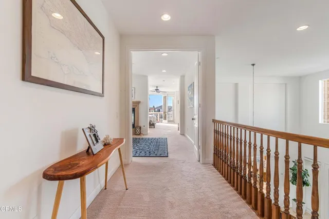 a bedroom with a bed and a potted plant