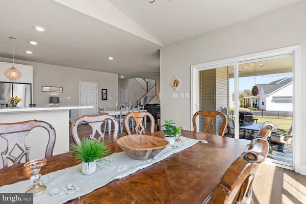 a kitchen with white cabinets and appliances