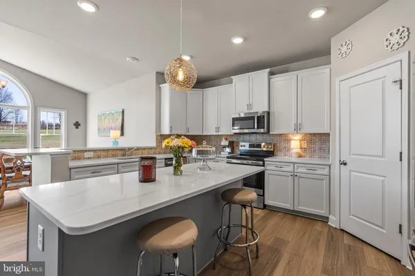 a view of a hallway with furniture and toys