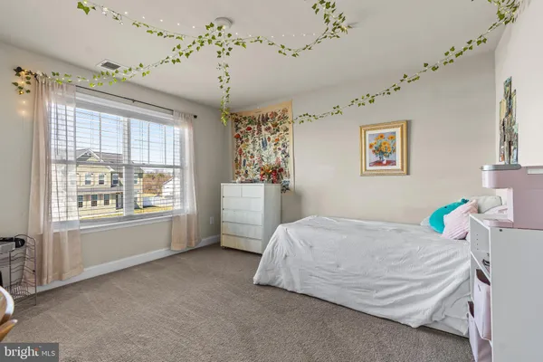 a bedroom with a bed and dresser