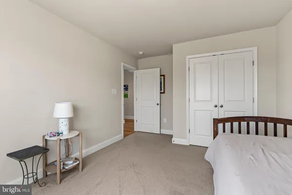 a view of walk in closet with clothes