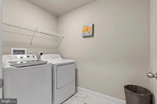 a view of a balcony with table and chairs