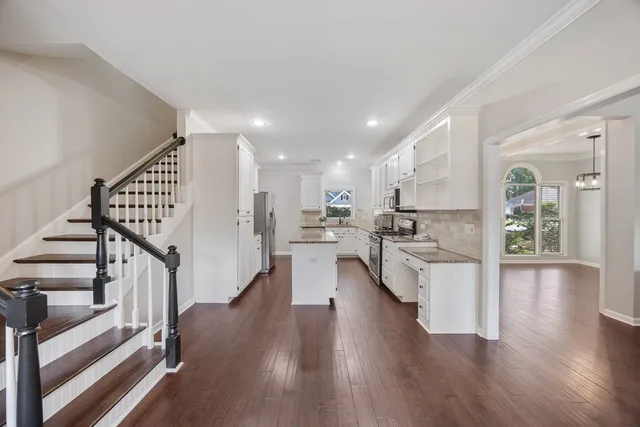 a view of kitchen with cabinets and wooden floor
