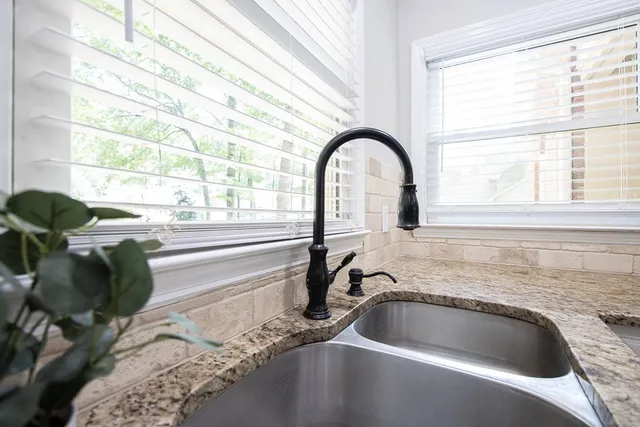 a kitchen with a sink and a window