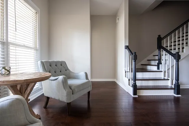 a view of entryway and hall with wooden floor