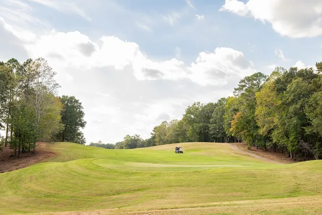 a view of a swimming pool with an outdoor space and seating area