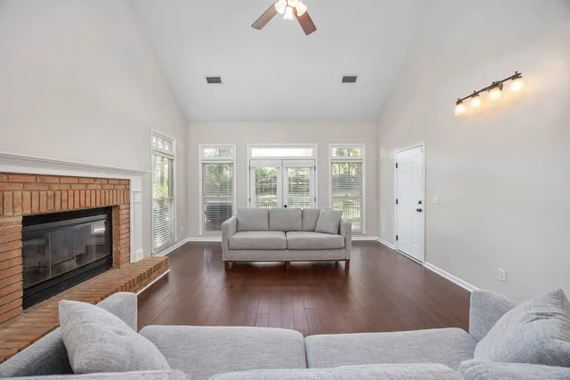 a living room with furniture window and a fireplace