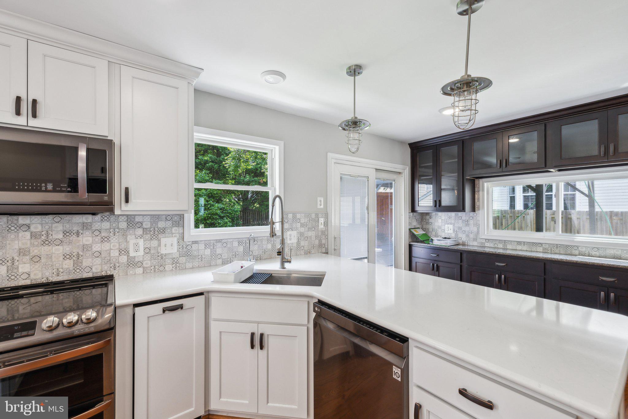 14 St Peters Court Stafford, VA 22556 - Photo 20 of 47 a kitchen with granite countertop a sink stainless steel appliances and cabinets