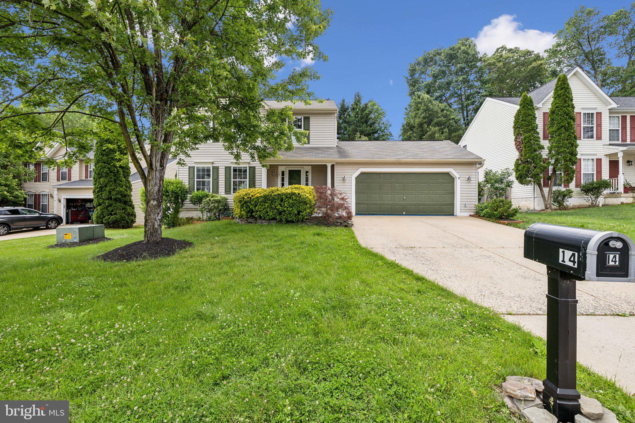 14 St Peters Court Stafford, VA 22556 - Photo 2 of 47 a front view of a house with garden