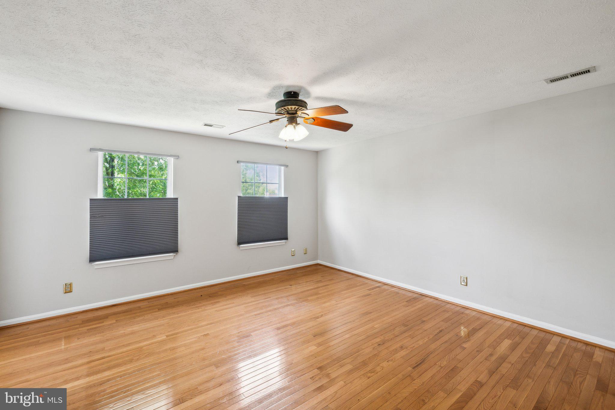 14 St Peters Court Stafford, VA 22556 - Photo 22 of 47 wooden floor in an empty room with a window