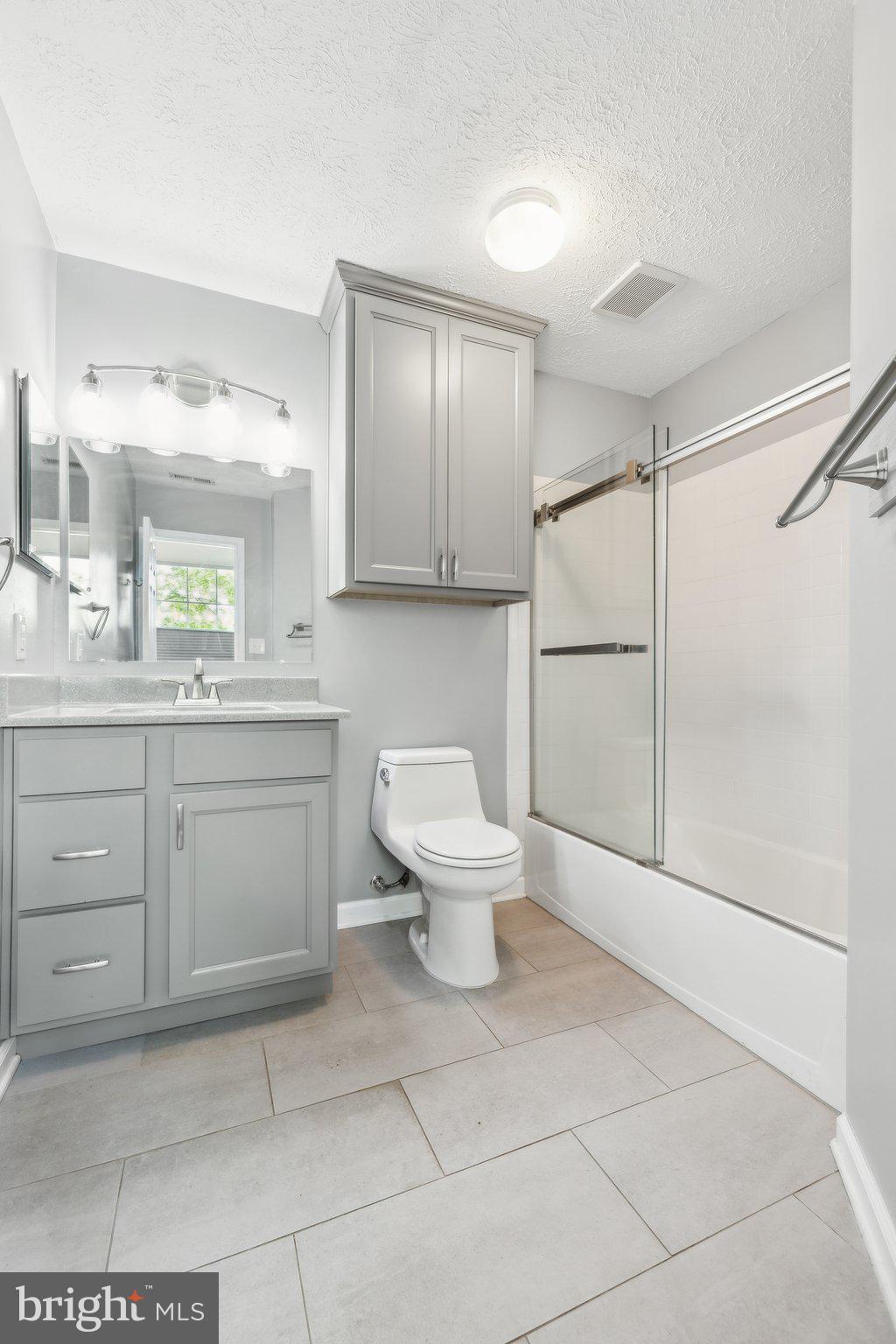 14 St Peters Court Stafford, VA 22556 - Photo 24 of 47 a bathroom with a toilet sink and a mirror