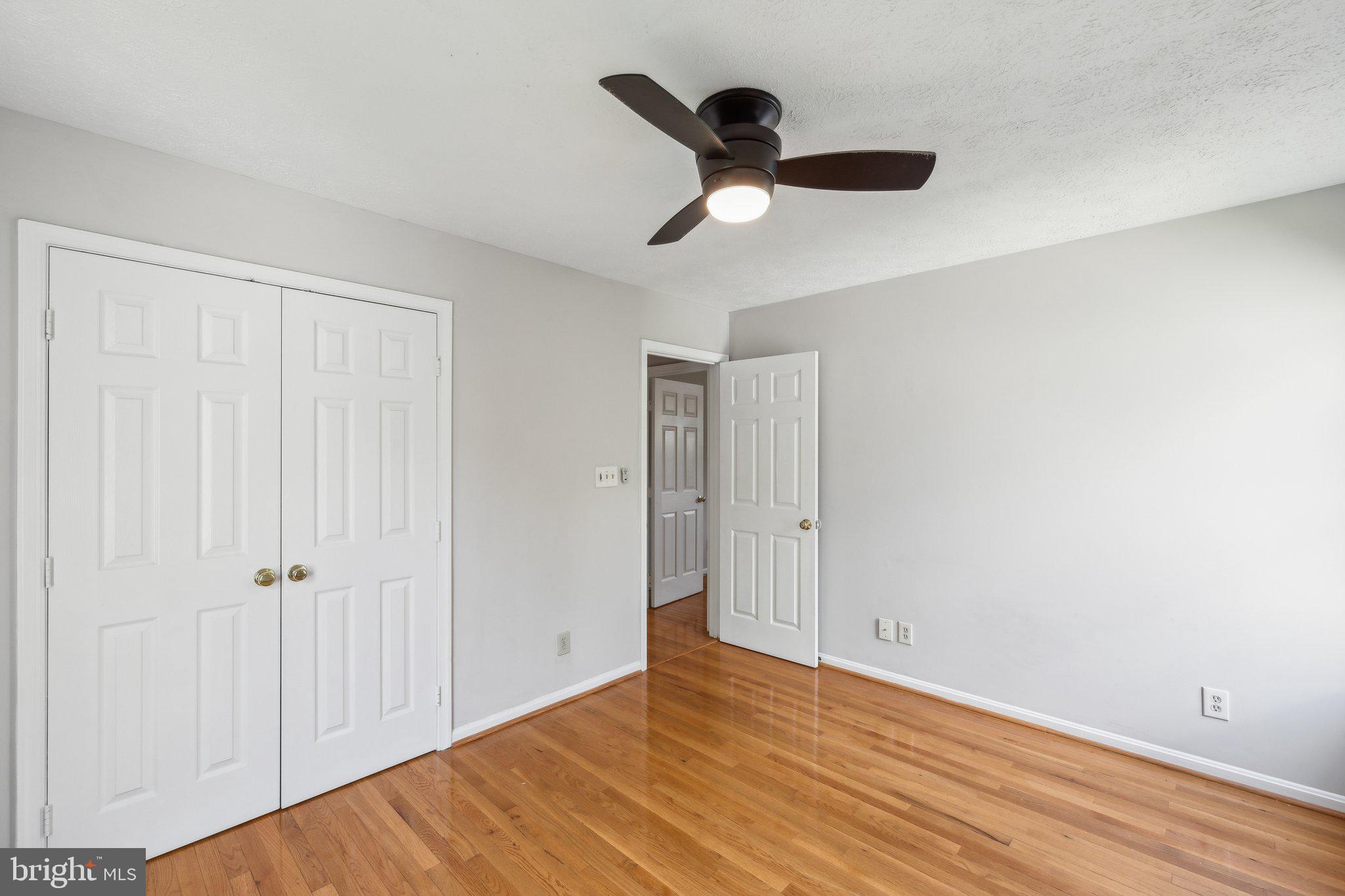 14 St Peters Court Stafford, VA 22556 - Photo 25 of 47 an empty room with wooden floor cabinet and windows
