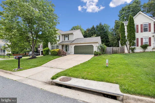 a view of house with outdoor space and sitting area