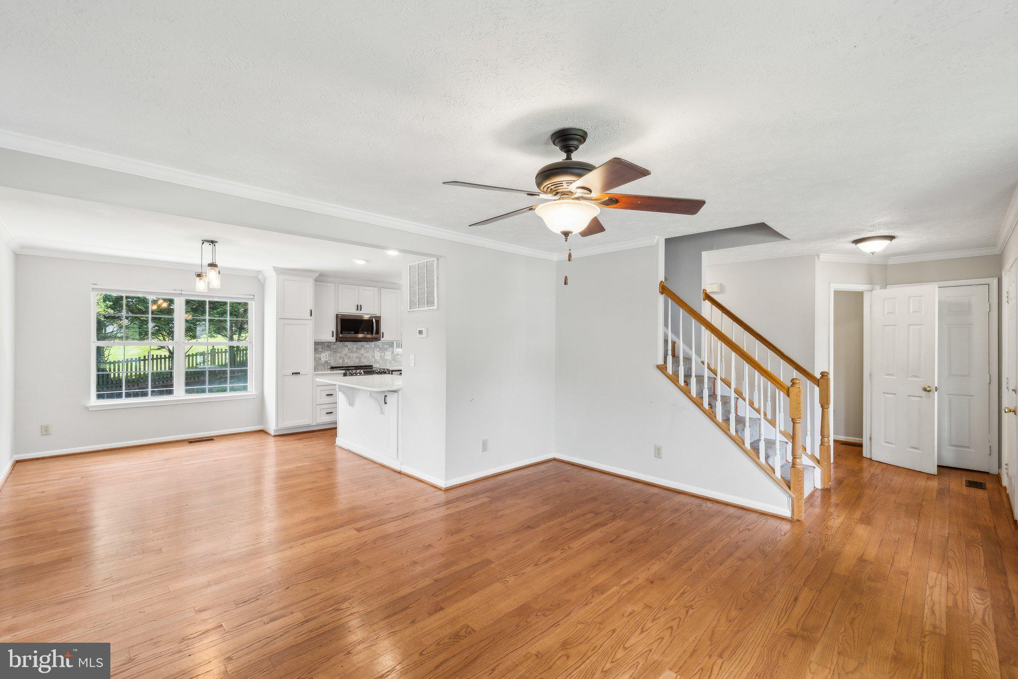 14 St Peters Court Stafford, VA 22556 - Photo 7 of 47 a view of an empty room with wooden floor and a window