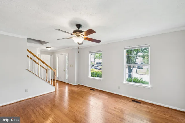 a view of an entryway with wooden floor