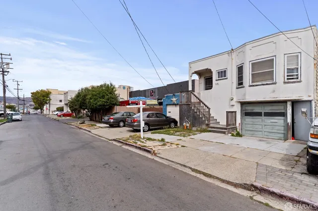 a view of a street with cars