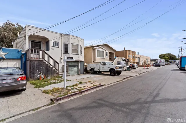 a view of a city street with tall buildings