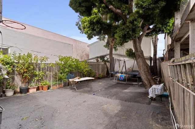 a view of a chair and tables in patio