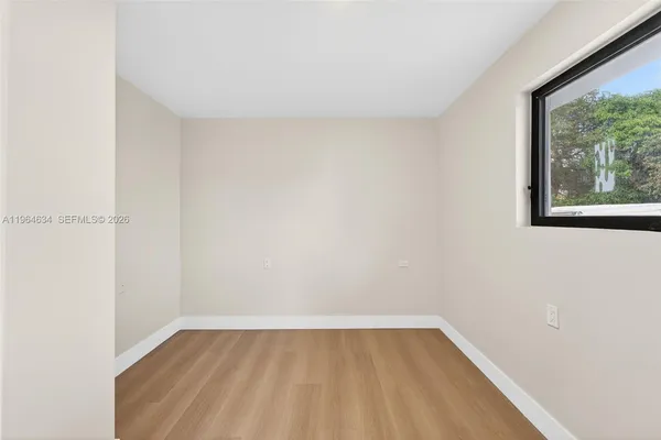 a view of a room that has a window in it