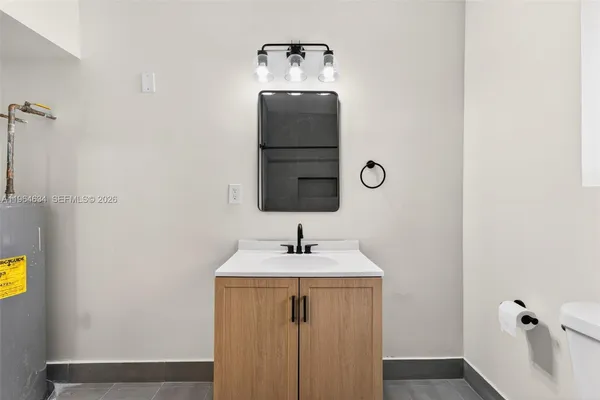 a bathroom with a sink and a mirror