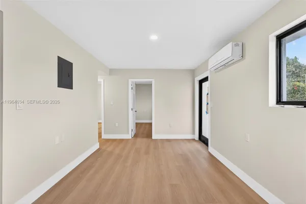 a view of hallway with wooden floor