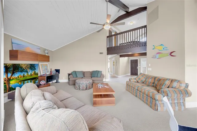 a kitchen with stainless steel appliances a stove top oven a sink a dining table and chairs