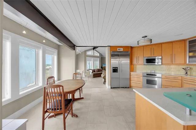 a view of a house with wooden floor and iron fence