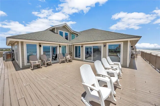 a spacious bedroom with a large bed and a flat screen tv