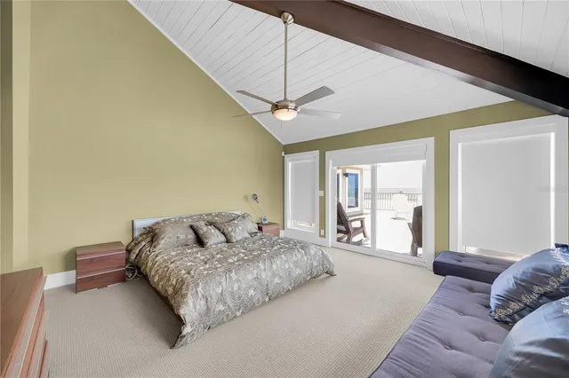 a living room with furniture a flat screen tv and a window