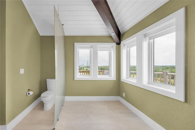 a bathroom with a granite countertop double vanity sink and mirror