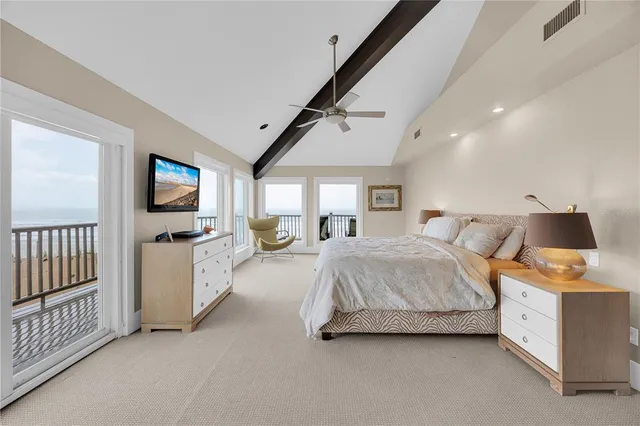 a view of ocean with a building in the background