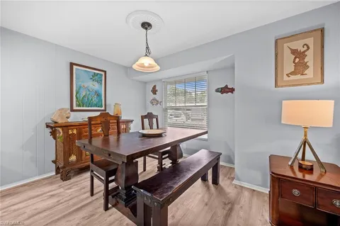 a view of a workspace with furniture and window