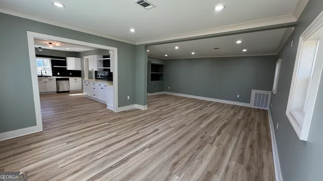 a view of kitchen with cabinets