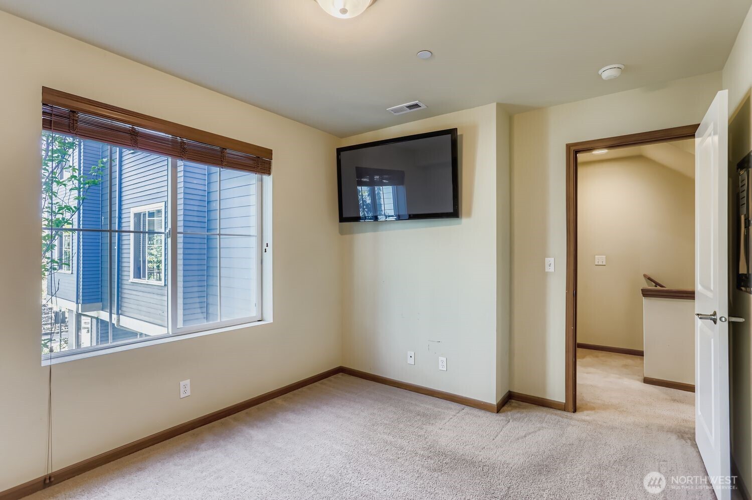 838 4th Avenue Northeast Issaquah, WA 98029 - Photo 13 of 26 a view of an empty room with a window and a kitchen