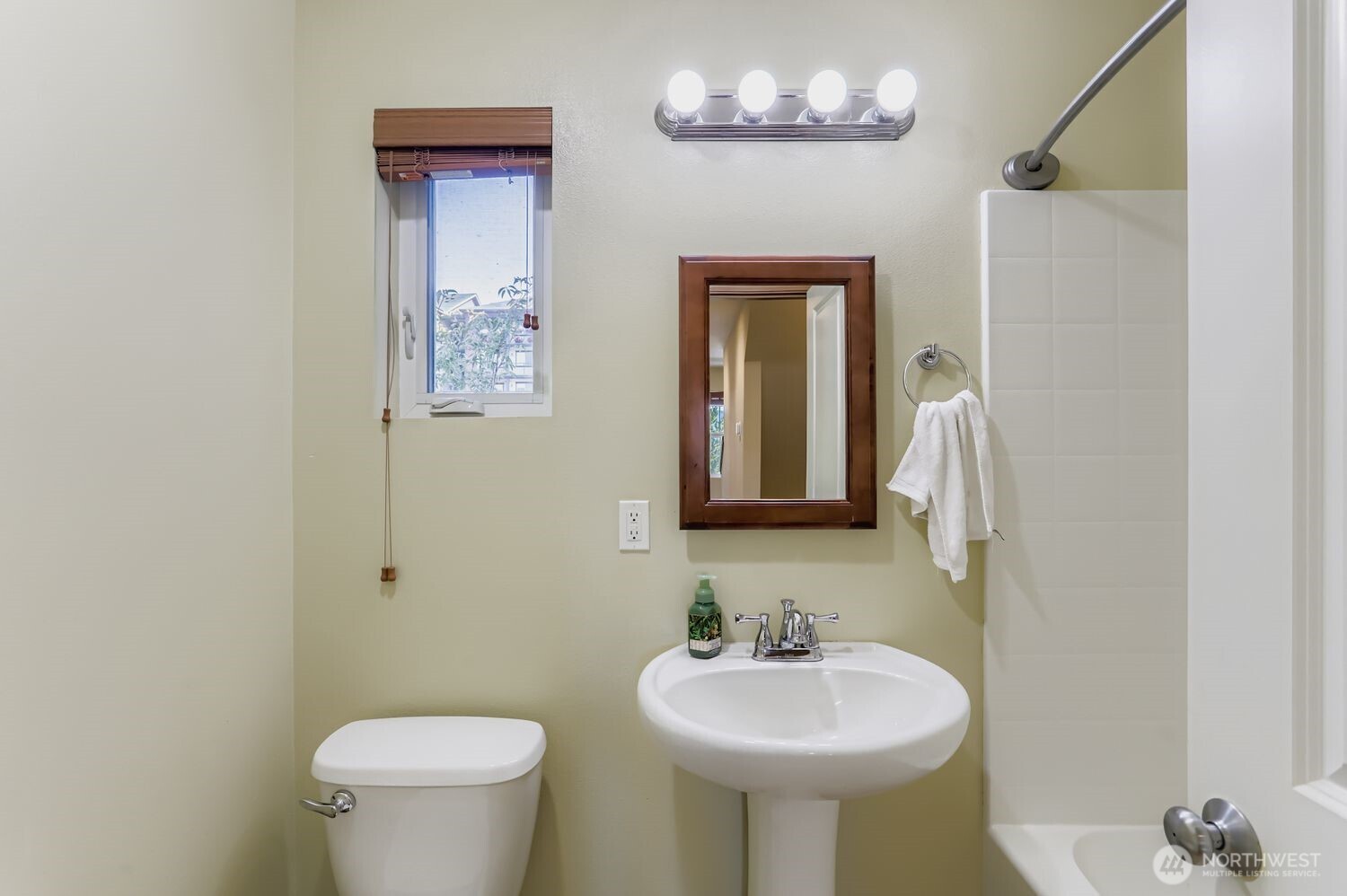 838 4th Avenue Northeast Issaquah, WA 98029 - Photo 14 of 26 a bathroom with a toilet sink and mirror