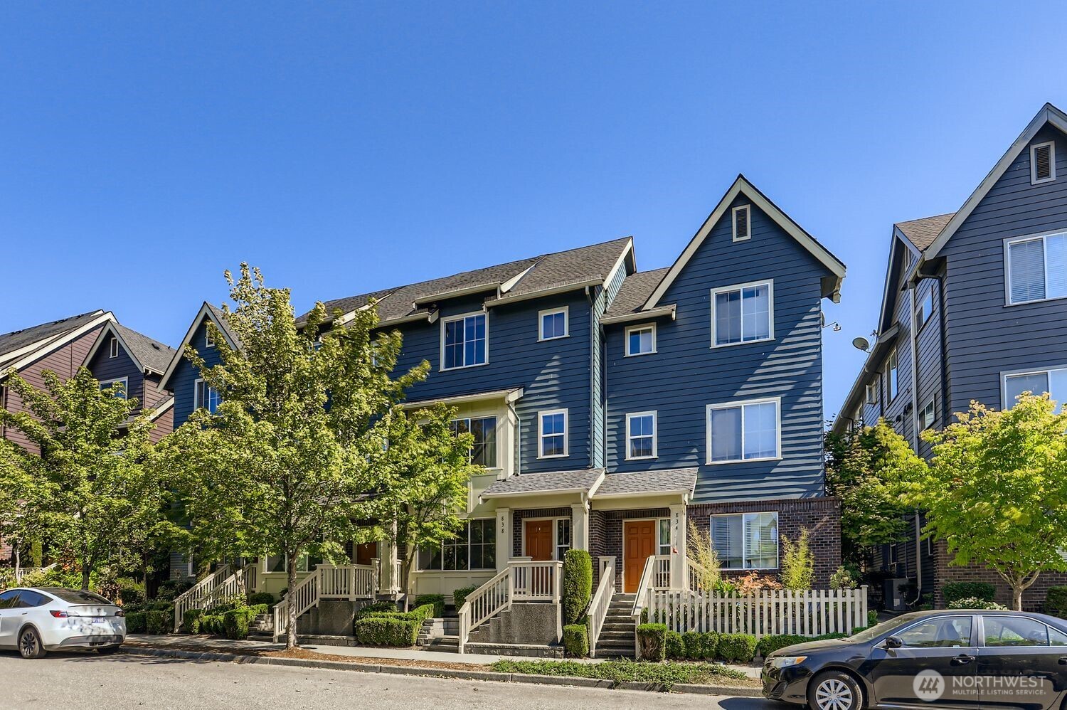 838 4th Avenue Northeast Issaquah, WA 98029 - Photo 2 of 26 a front view of a residential apartment building with a yard