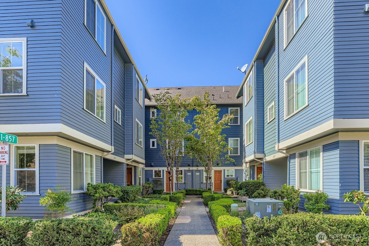 838 4th Avenue Northeast Issaquah, WA 98029 - Photo 25 of 26 a view of a building next to a yard