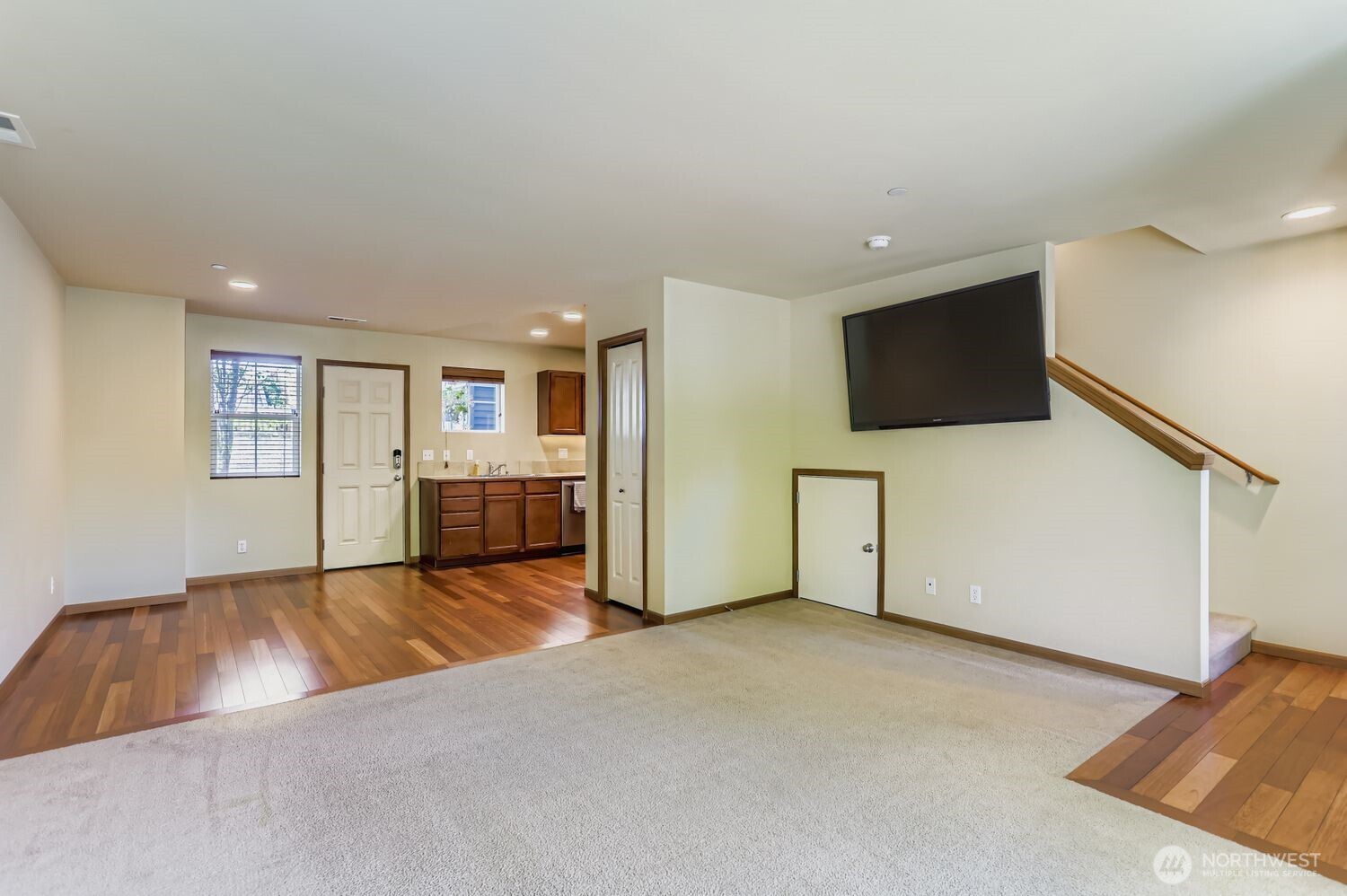 838 4th Avenue Northeast Issaquah, WA 98029 - Photo 7 of 26 a view of a livingroom with furniture and a flat screen tv